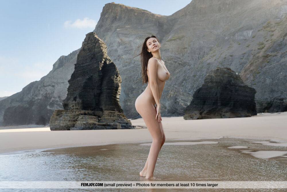 Beautiful brunette Alisa I shows off her great tits during nude poses on beach - #7