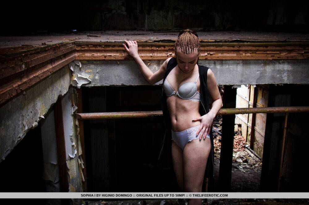 Slender teen Sophia I stands naked after disrobing in an abandoned building - #7