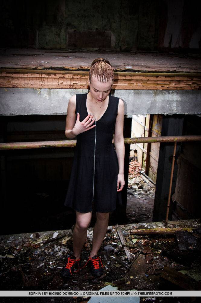 Slender teen Sophia I stands naked after disrobing in an abandoned building - #16