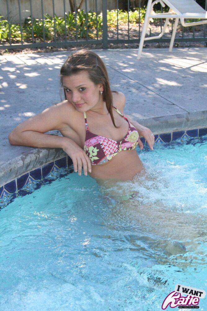 Cute teen Kate Crush covers up her bare tits after removing bikini top in pool - #6