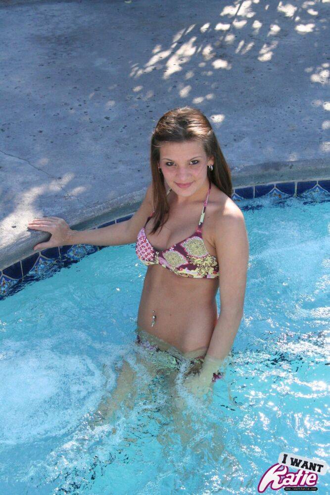 Cute teen Kate Crush covers up her bare tits after removing bikini top in pool - #9