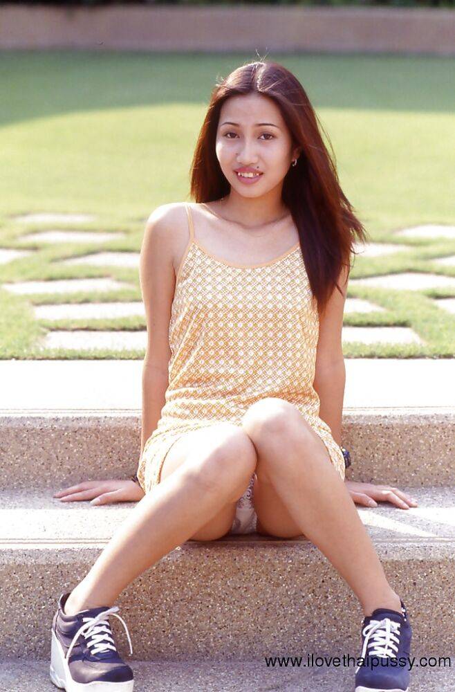 Asian cutie uncovering her sexy body and spreading her slender legs - #7