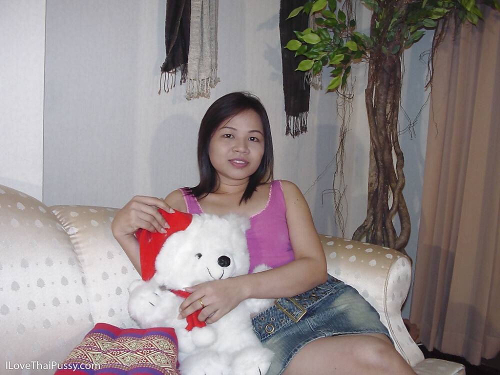 Chubby asian cutie taking off her clothes and posing naked on the sofa - #1