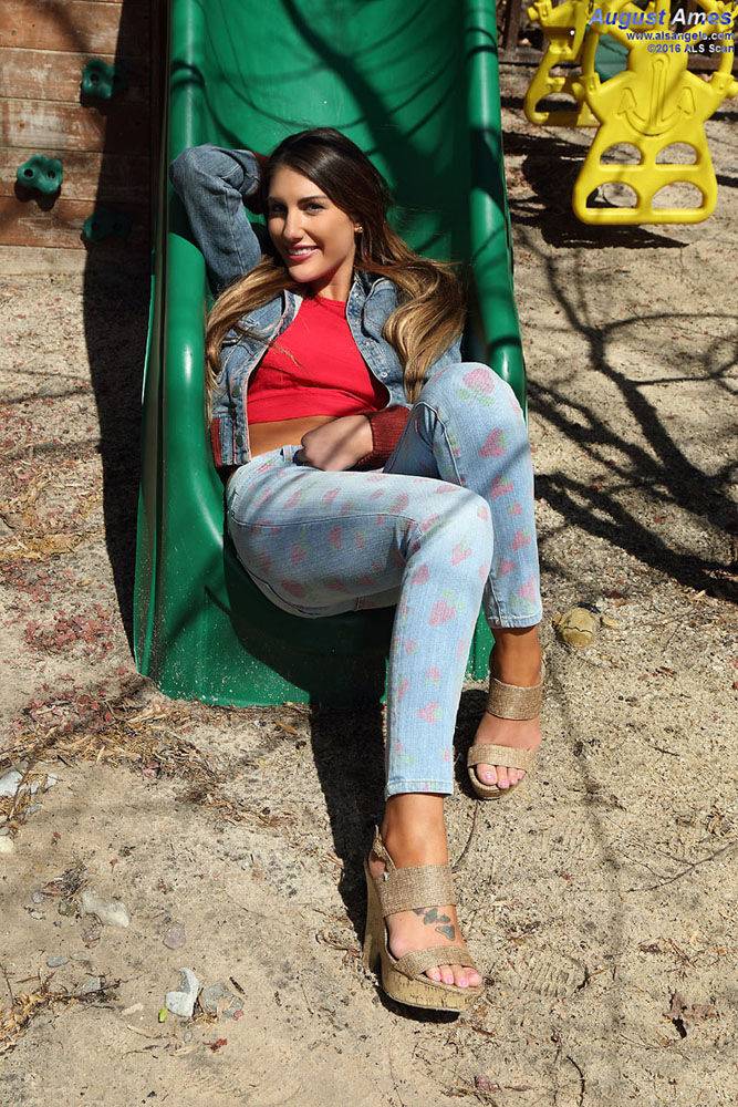 Busty amateur female August Ames spreading pussy lips apart on swing set - #5