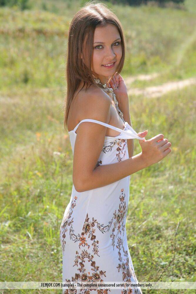 Petite white girl Rita B models naked in a farmer's field - #7