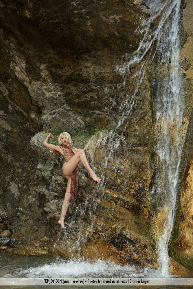 Beautiful blonde Adelia B models totally nude underneath a waterfall - #11