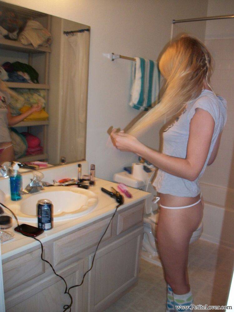 Blonde amateur Elle brushes her hair in glasses and thong while in a bathroom - #8