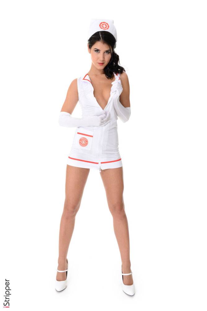 Dark haired nurse Lady Dee peels off her uniform during a solo engagement - #9