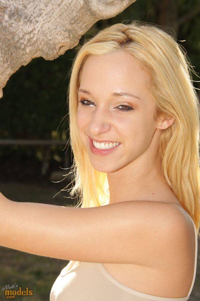 Natural blonde Jada Stevens flaunts her hot ass as she disrobes by a tree - #3