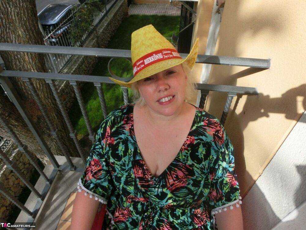 Mature fatty Barby poses naked in a hat on her balcony before masturbating - #1