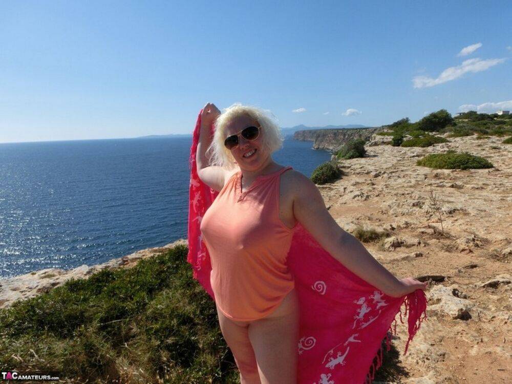 Mature plumper Barby gets naked while visiting a Spanish tourist site - #12