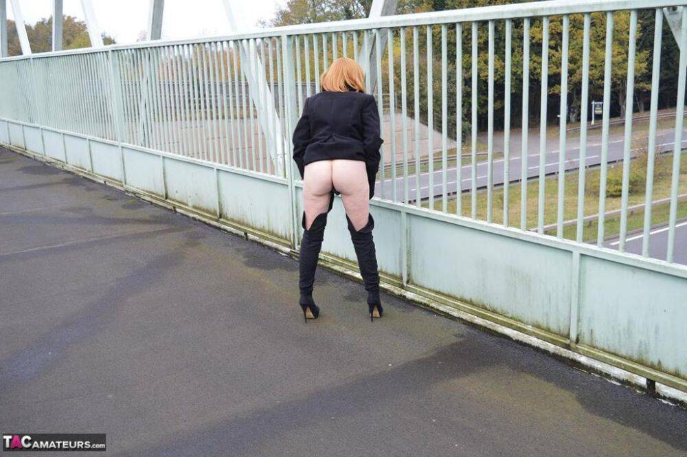 Mature redhead Barby Slut exposes herself in public while wearing OTK boots - #8