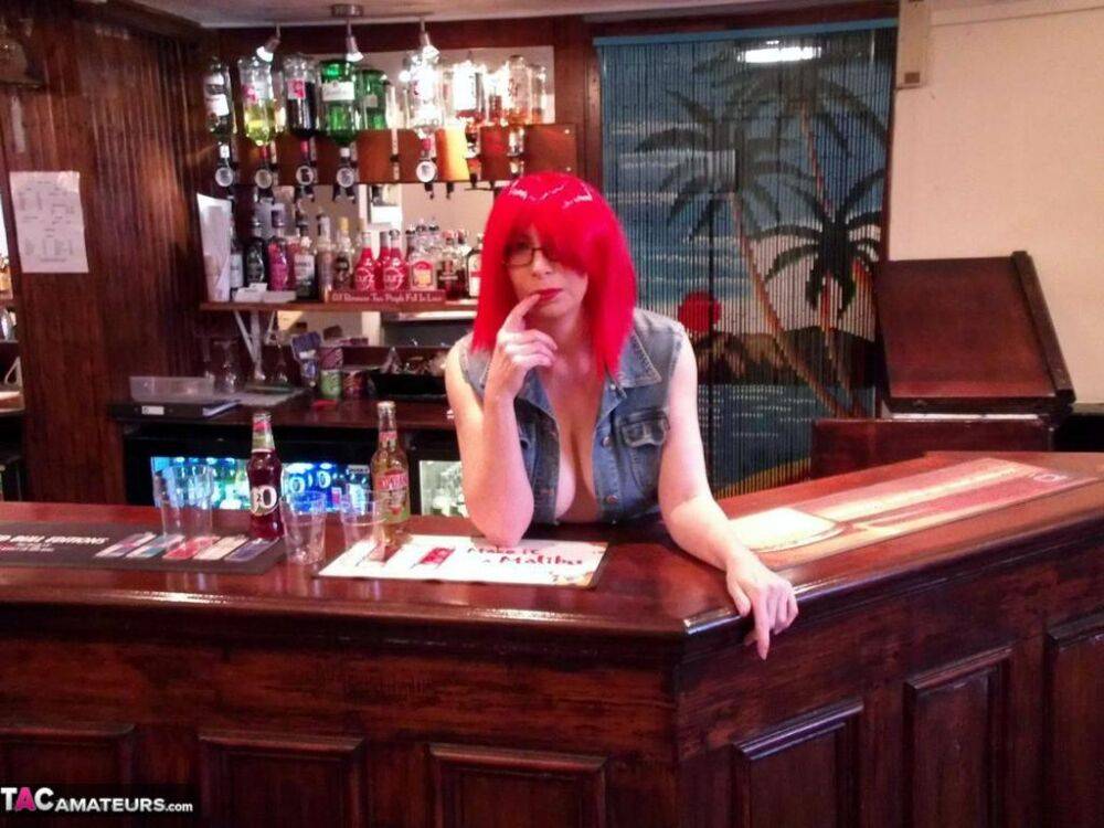 Redheaded amateur Barby Slut exposes her tits and ass while tending bar - #2