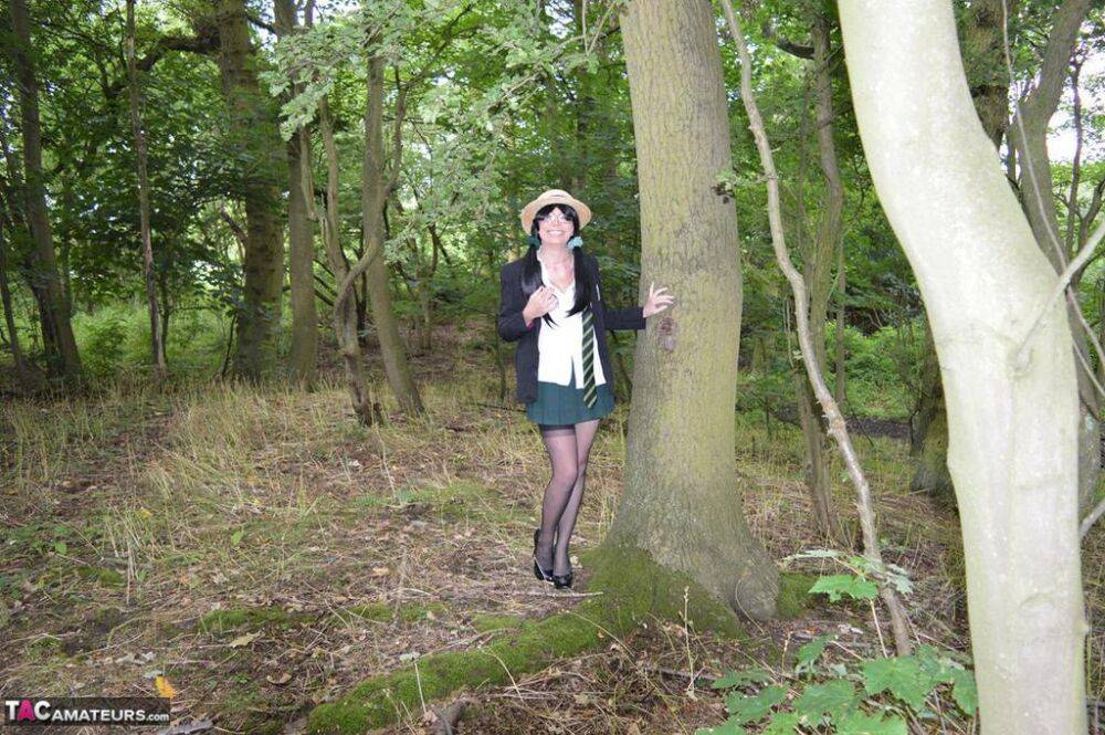 Older amateur Barby Slut exposes herself in the woods in schoolgirl apparel - #7