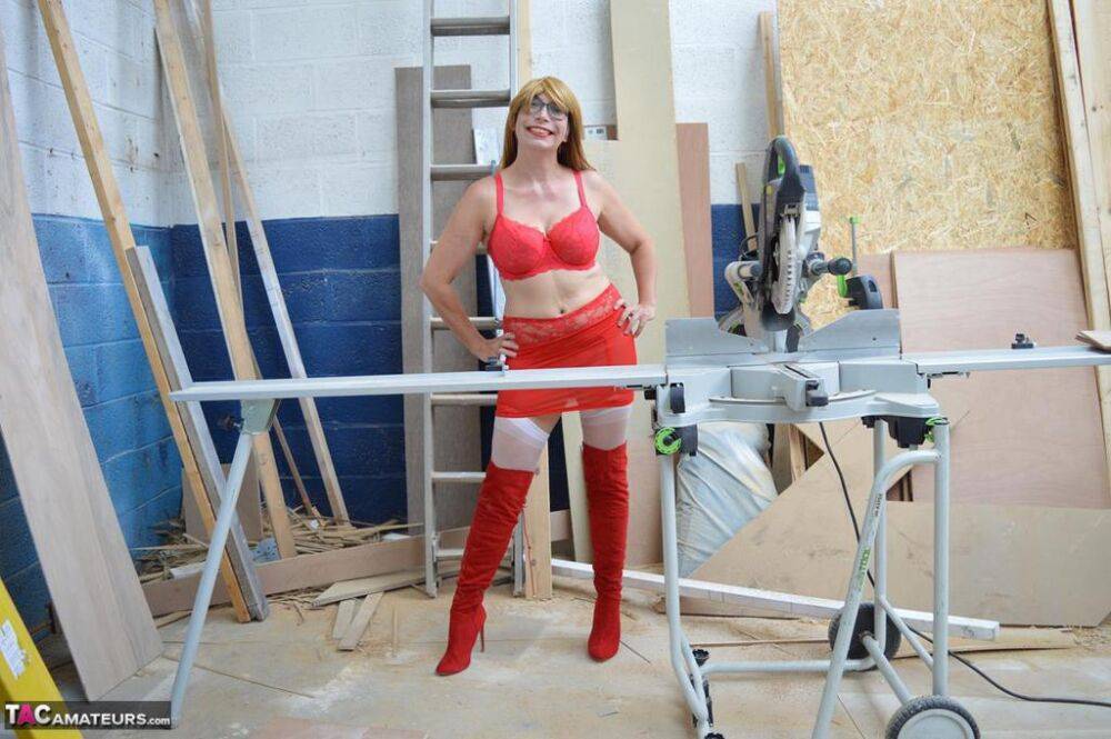 Middle-aged woman Barby Slut gets naked at a job site in OTK boots & nylons - #10