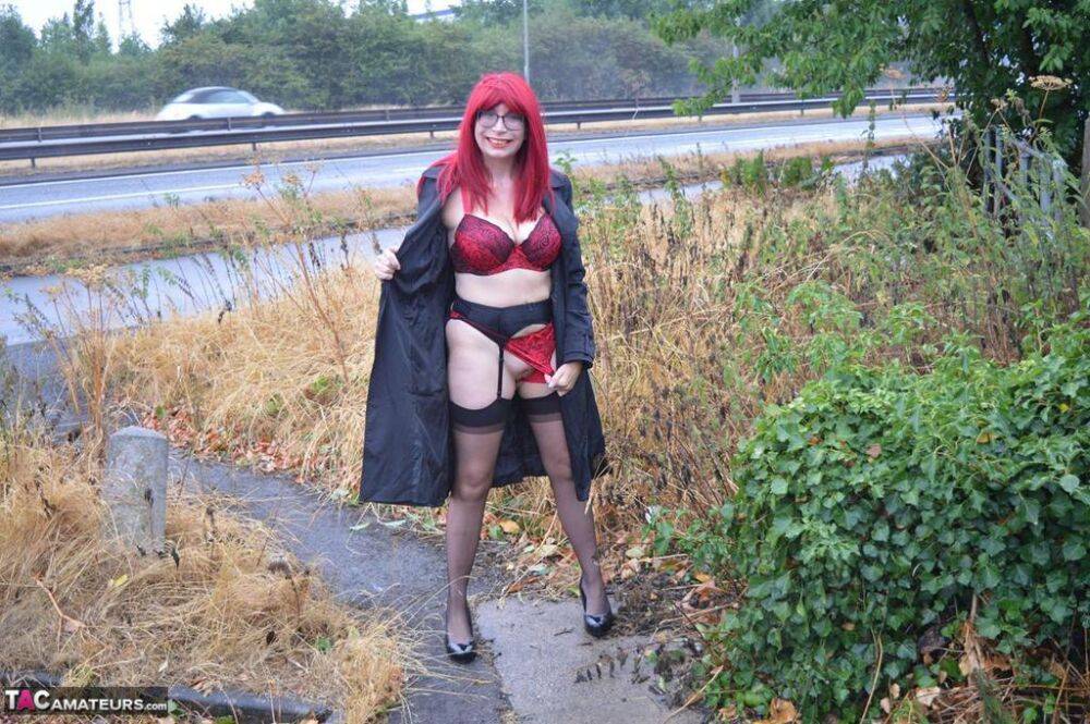 Mature redhead Barby Slut gets naked in public places on a wet day - #3