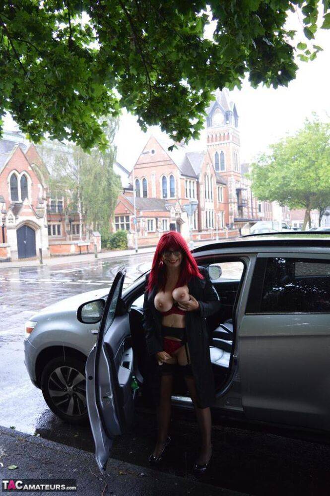 Mature redhead Barby Slut gets naked in public places on a wet day - #16