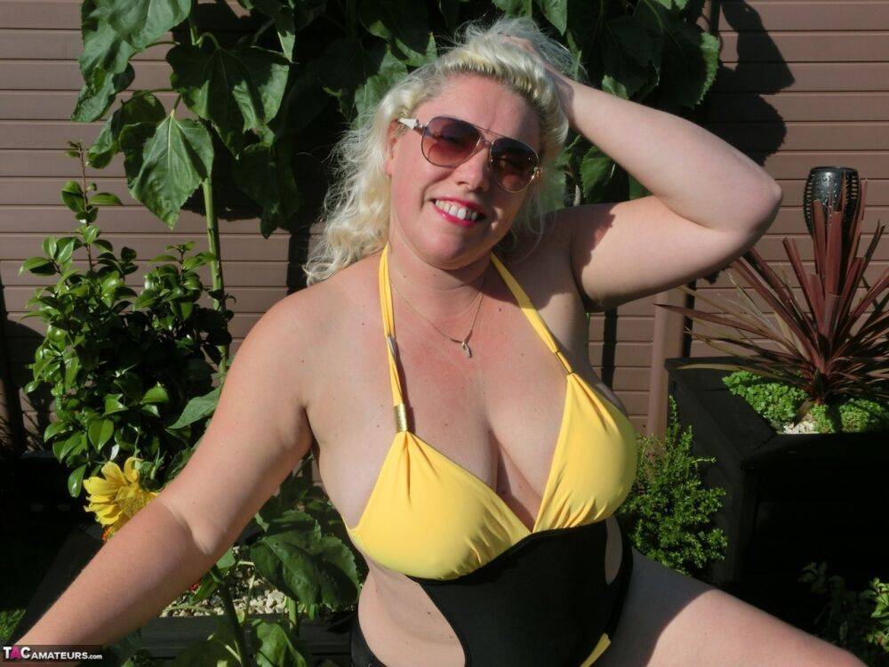 Overweight mature blonde Barby gets naked in a yard before masturbating - #4