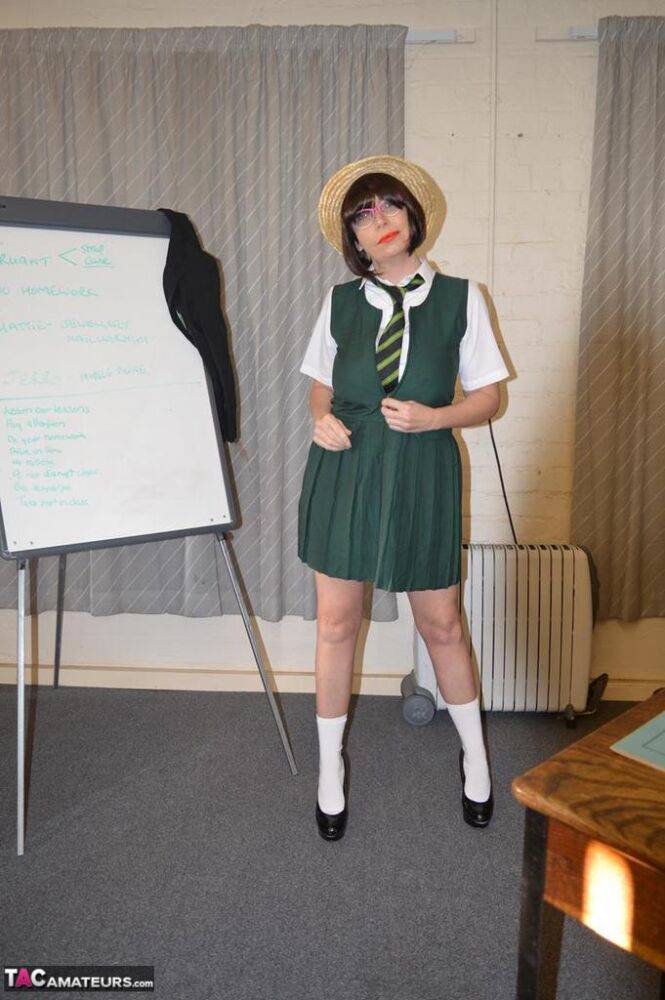 Older lady Barby Slut removes schoolgirl clothing during a solo shoot - #12