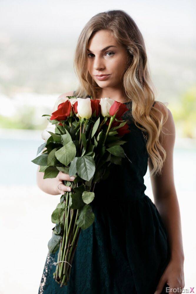 Blonde teen Sydney Cole smells a bunch of flowers before getting naked - #6