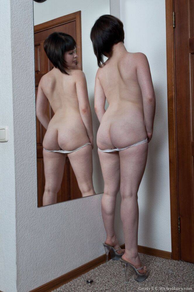 White teen with a full bush admires herself in mirror while disrobing - #5