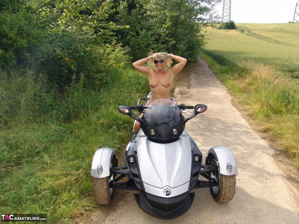 Middle-aged blonde Sweet Susi rides a three wheeled motorcycle while naked - #5