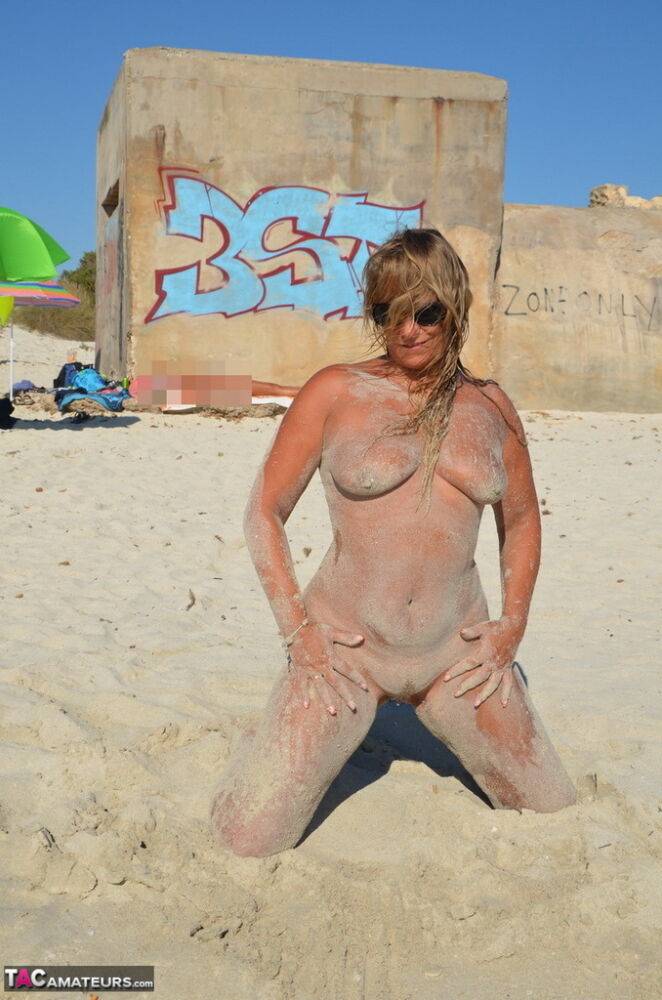 Naked amateur Sweet Susi covers her body in beach sand in sunglasses - #13