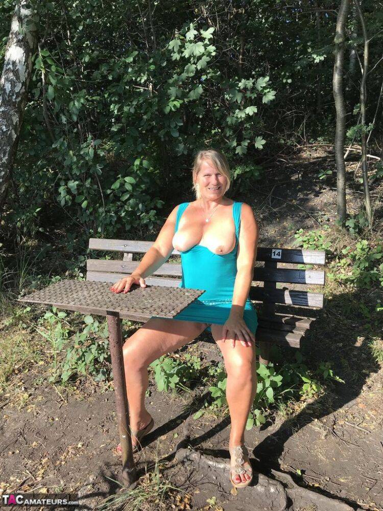 Overweight mature woman Sweet Susi gets completely naked on riverside bank | Photo: 1327483