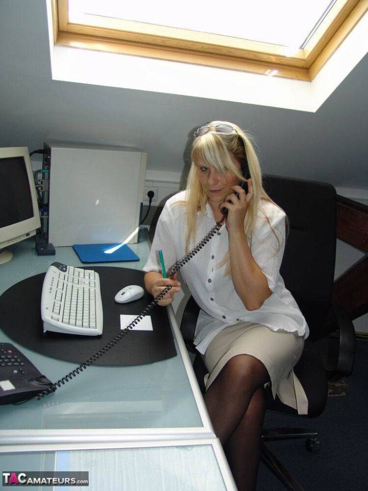 Blonde medical secretary Sweet Susi strips to stockings at her workstation - #15