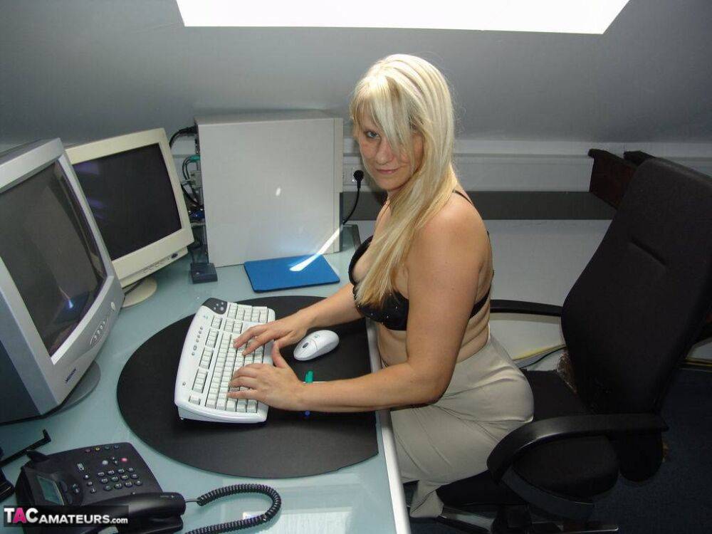 Blonde medical secretary Sweet Susi strips to stockings at her workstation - #16