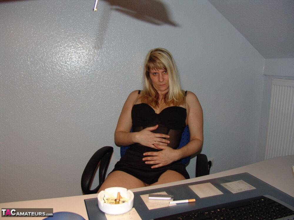 Mature amateur smokes a cigarette before masturbating in office chair - #8