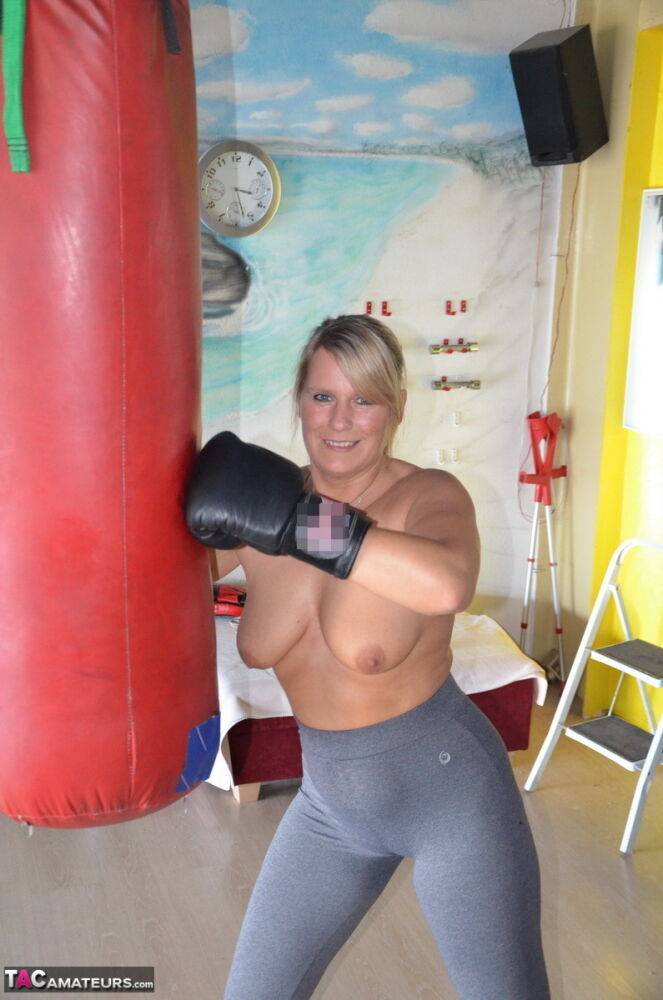 Middle-aged blonde Sweet Susi gets naked after working out with a punching bag - #4