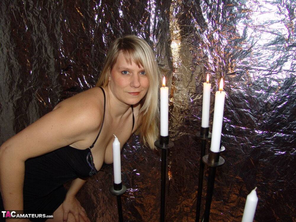 Blonde amateur Sweet Susi lights a lot of candles before getting nude in heels - #7