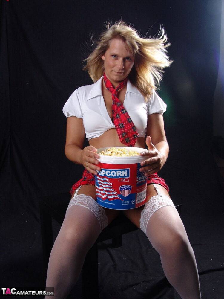 Blonde amateur Sweet Susi gets completely naked while eating a tub of popcorn - #16