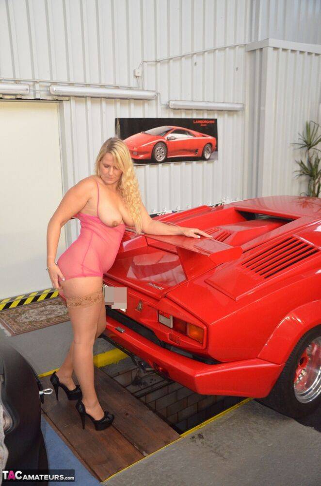 German MILF Sweet Susi exposes her tits in front of a Lamborghini - #11