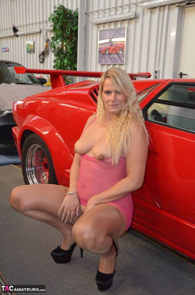 German MILF Sweet Susi exposes her tits in front of a Lamborghini - #16