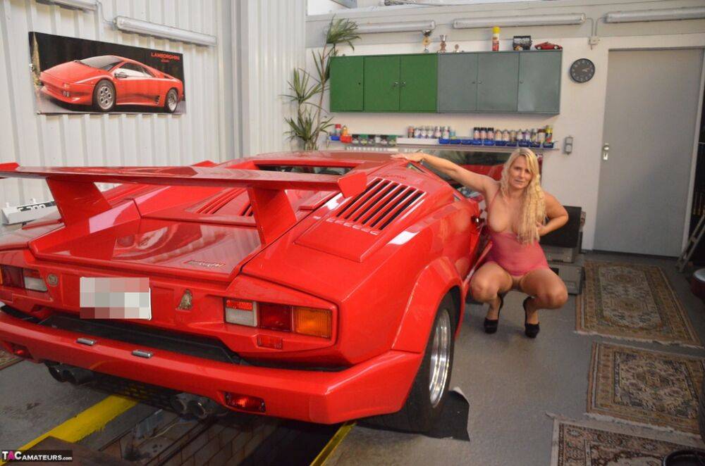 German MILF Sweet Susi exposes her tits in front of a Lamborghini | Photo: 1330337