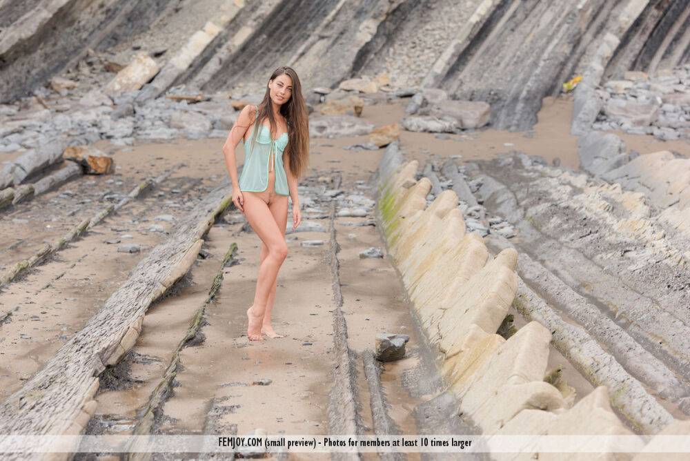 Long haired model Lorena G doffs sheer lingerie to pose nude on rocky terrain - #11