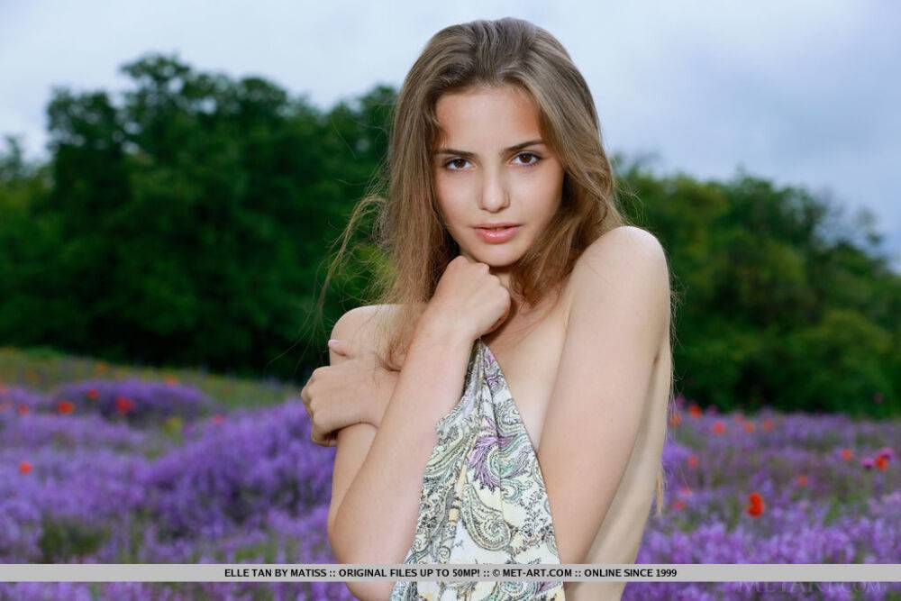 Teen solo girl Elle Tan bares her slim figure in front of wild flowers - #15