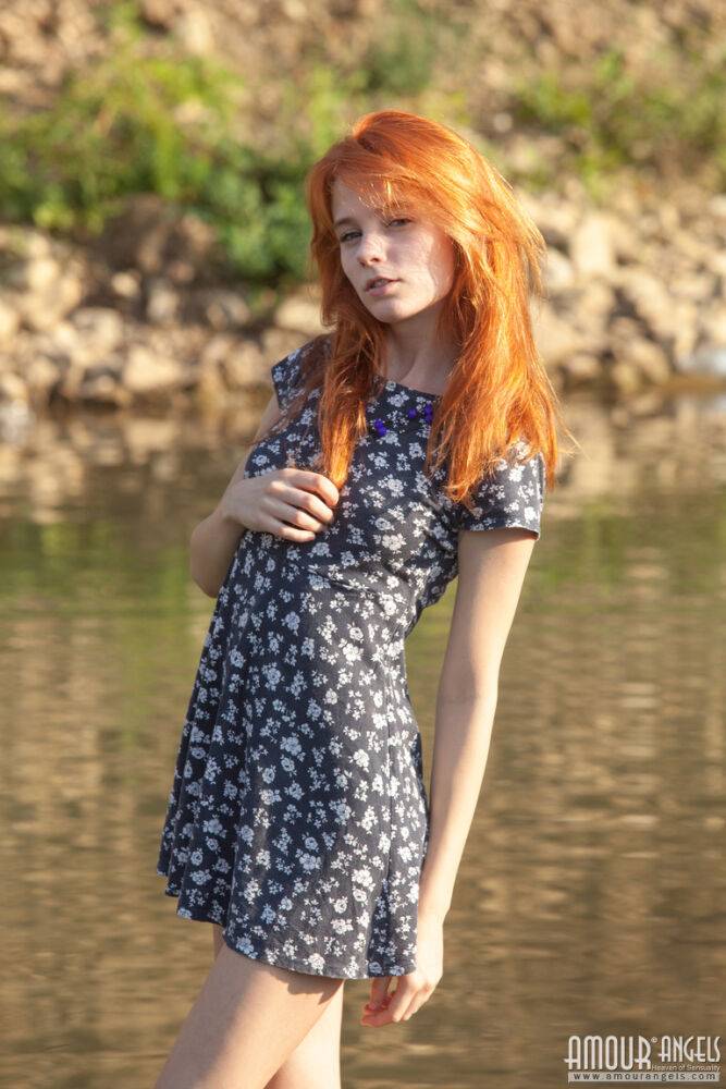 Sexy redheaded teen poses her thin body in the nude by a stream - #13