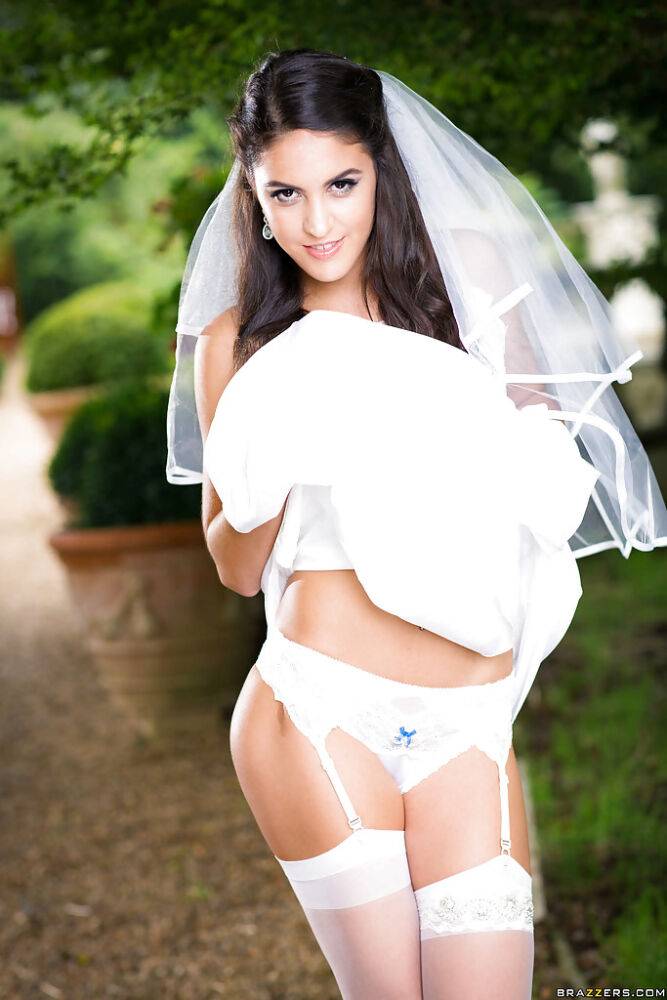 Newly married bride Carolina Abril posing outdoors in wedding dress - #8