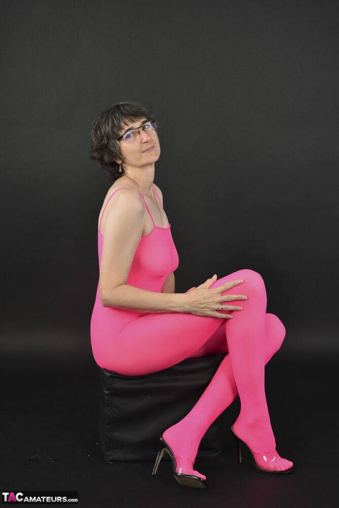 Mature amateur Hot MILF takes off a crotchless pink body stocking in glasses - #4