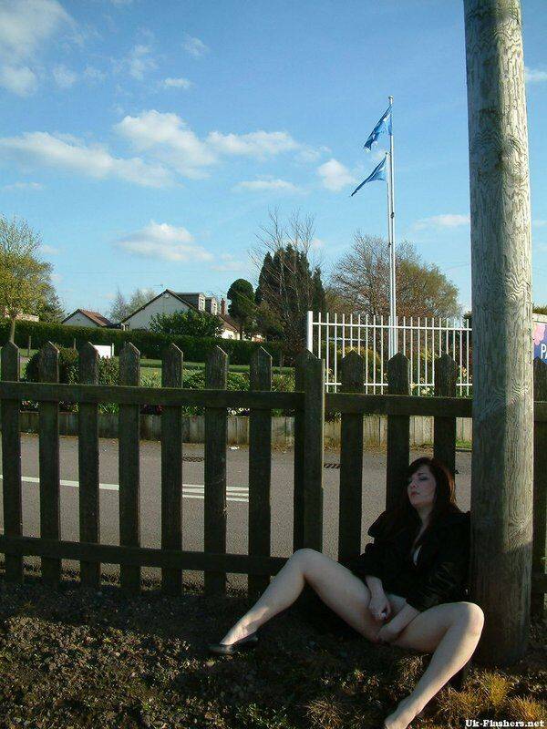 British female masturbates her pink pussy against a fence in public - #8