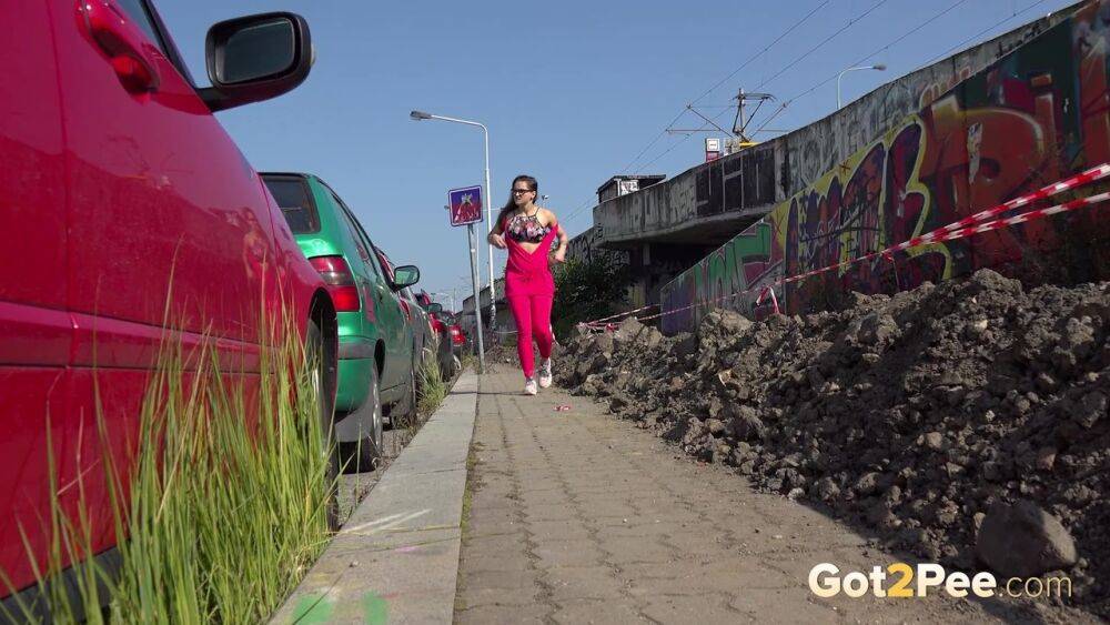 White girl Barbara Bieber pulls down pink leggings to piss on a sidewalk - #15