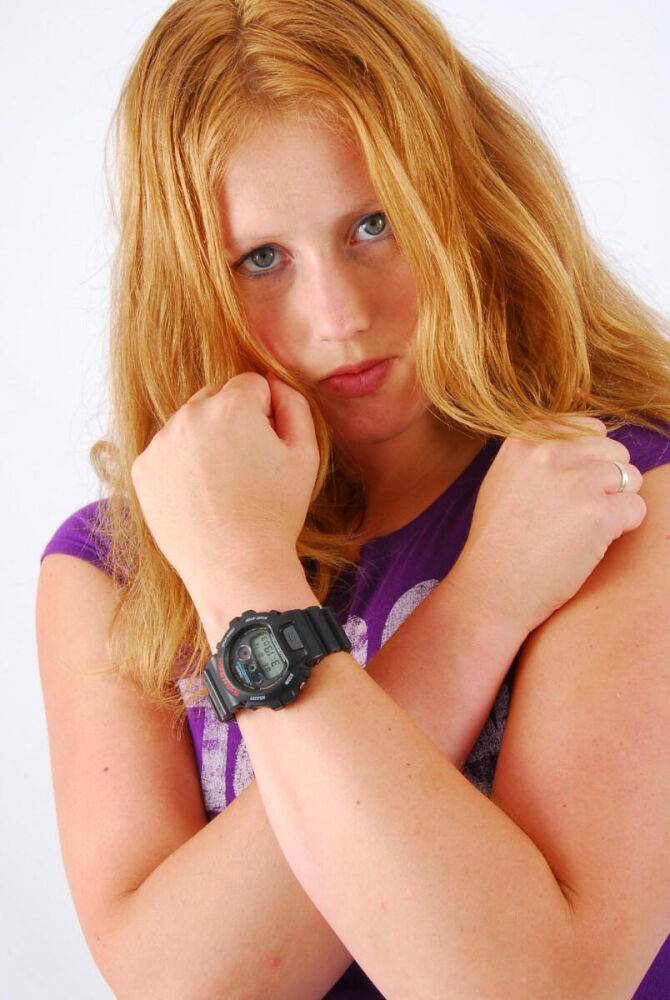 Natural redhead Judy models a black G-Shock watch while fully clothed - #16