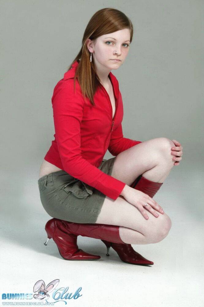 Pale redhead Lilly slowly strips to a black G-string and red leather boots - #11