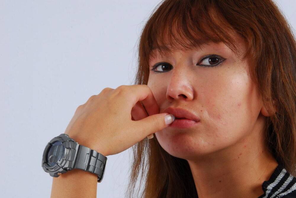 Asian redhead Evita models a grey G-Shock watch while fully clothed - #2