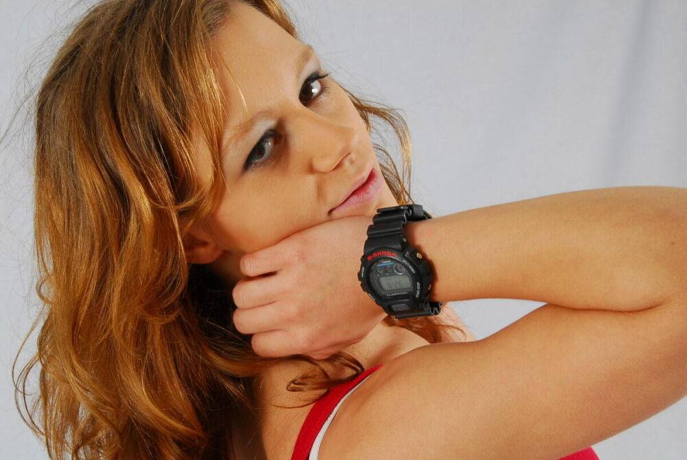 Natural redhead Sabine shows off her black G-shock watch while fully clothed - #16