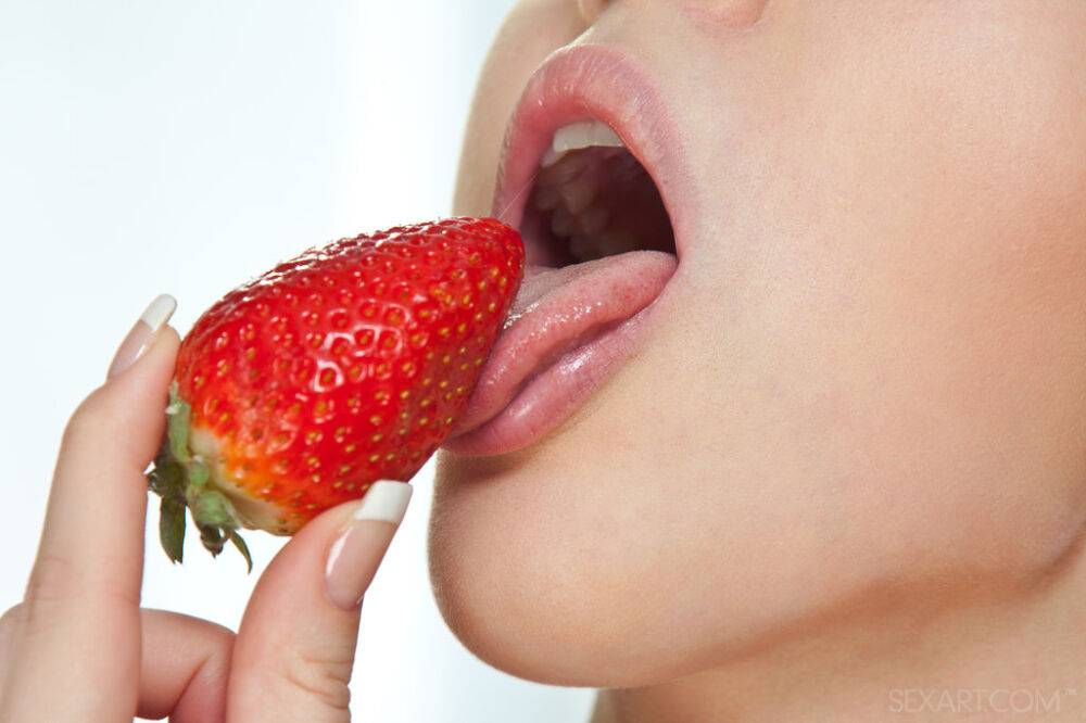 Naked teen Margo G slips a strawberry inside her edible pussy - #11