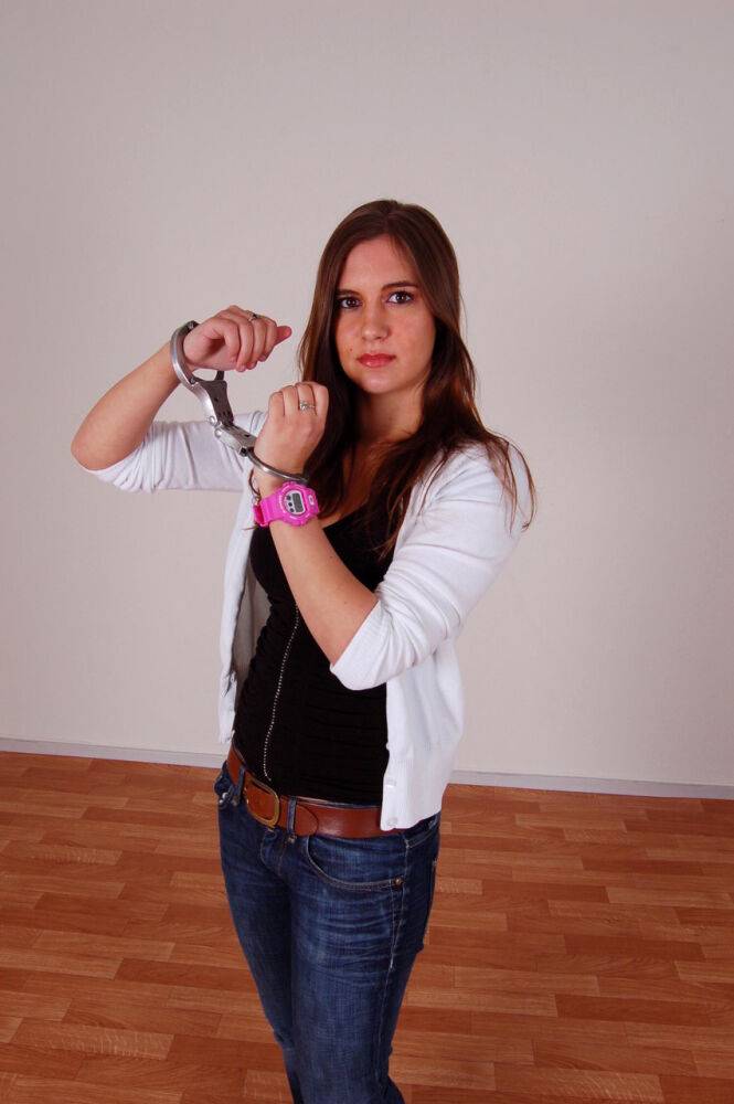 Redheaded amateur Stacey models a G-Shock watch and LIPS handcuffs in jeans - #15